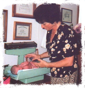 A newborn picture of Kallista with our midwife Nancy.